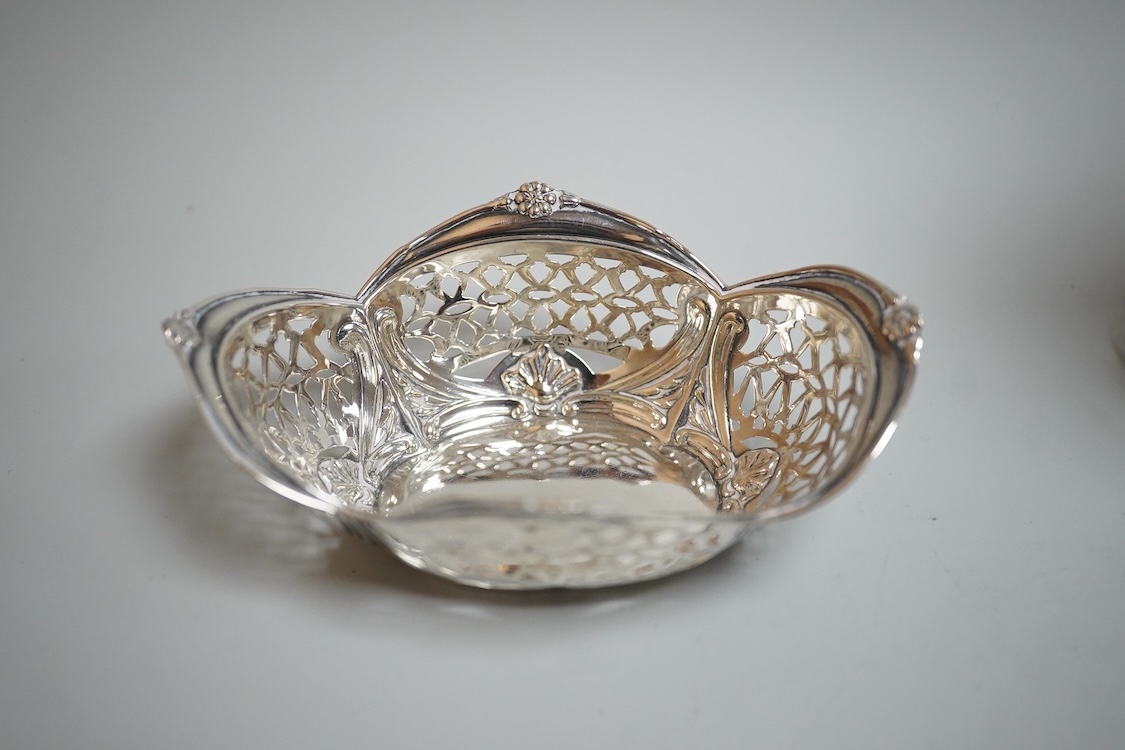 Sundry silver including two George V silver sauce boats, a silver café au lait pot, a small silver cream jug, three small silver dishes, a silver mounted glass sugar sifter and a silver mounted glass ashtray.